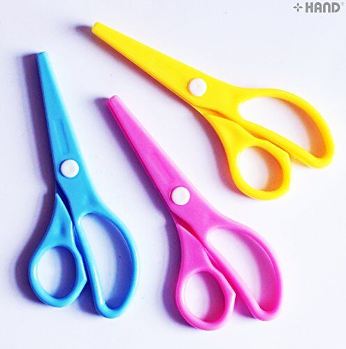 Close-up of the colourful handles of the kids safe scissors.