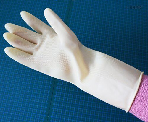 DFH rubber gloves displayed in a garden setting.