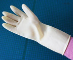 DFH rubber gloves displayed in a garden setting.