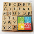 Box containing 26 wooden rubber stamps of capital letters