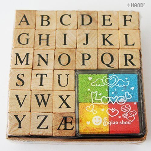 Box containing 26 wooden rubber stamps of capital letters