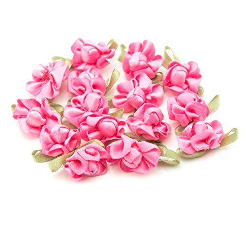 Bright pink ribbon bow sew on trim with fabric flower detail.