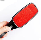 Lint brush in use on a fabric surface, removing hair