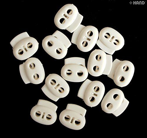 White toggle spring stop cord locks on a craft table