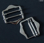 Pack of 20 silver tone shoe handbag buckles arranged neatly