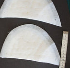 Shoulder pads displayed on a sewing table