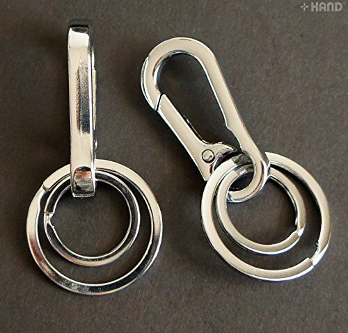 Key rings and buckle set on a neutral background.