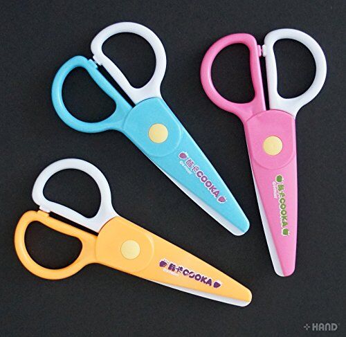 Kids using plastic scissors for craft activities
