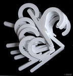 Close-up of a white plastic hanger showing its design.