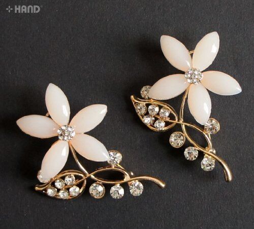 Two crystal cream flower gold brooches displayed on a white background.
