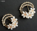 Two elegant crystal cream flower gold brooches displayed together.
