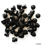 Various angles of black plastic round toggle spring stop cord locks.