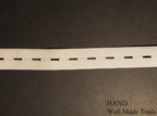 Elastic being used to finish a fabric edge neatly