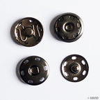 Dark copper snap studs arranged neatly for easy viewing