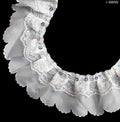 Close-up of white decorative two layer nylon lace trim with sequins