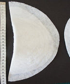 Close-up of the white canvas material of shoulder pads