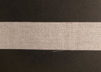 Application of the iron-on waist band fuse on tailored trousers.
