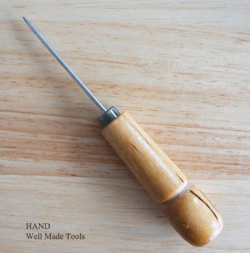 Heavy duty clickers awl with wooden handle and sharp blade.