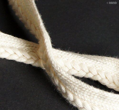 Close-up of 100% cotton cream plait edge pipe trim