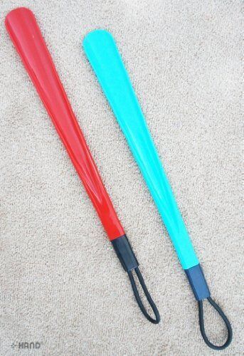 Shoehorns hanging from a hook, showcasing the convenient loop.