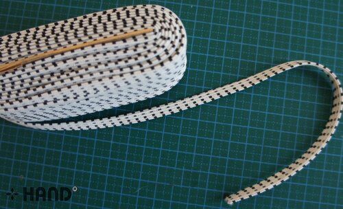 Close-up of red and white patterned elastic for sewing