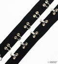 Continuous silver hooks and eyes on black tape, 2 metres long.