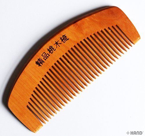 Two natural peach wooden anti-static hair combs on a white background.