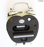 Alarm clock showing time with a vibrant apple design