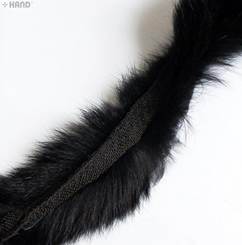 Black rabbit fur sew in pipe trim displayed on a sewing table.