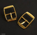 Polished gold tone square metal belt buckle on a white background