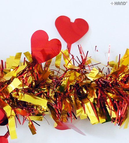 Red heart tinsel garland hanging decoratively