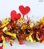 Red heart tinsel garland hanging decoratively