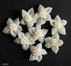 Arrangement of white flowers with pearls for wedding crafts.