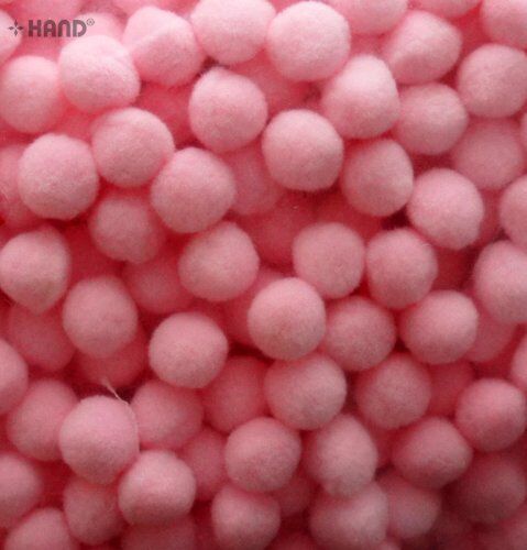 Assorted light pink pompoms displayed for craft use.
