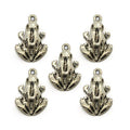 Silver metal frog pendant on a white background.