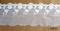 Vintage cream embroidered tulle lace edging on a roll.