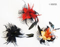 Three dotted feather flower brooches displayed together