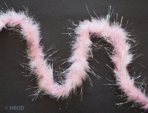 Baby pink feather garland with silver trim displayed on a white background.