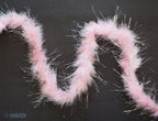 Close-up of the baby pink feathers and silver trim of the garland.