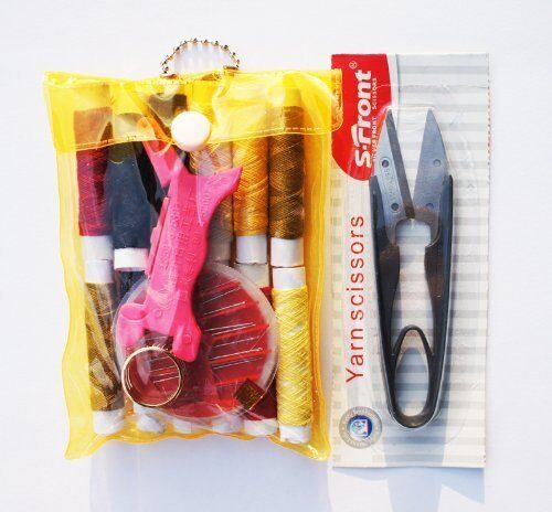 Assorted threads and needles in a well-presented sewing kit