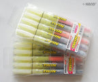 Close-up of twin highlighters showing vibrant ink tips.