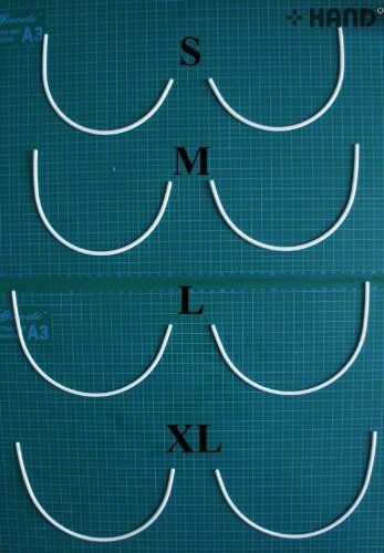 Five pairs of size S plastic bra under wires displayed together.