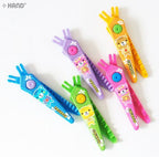 Scissors cutting through colourful paper for crafts