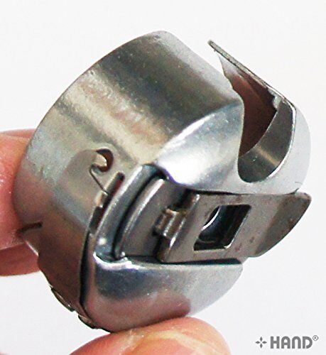 Towa bobbin case displayed on a sewing machine.