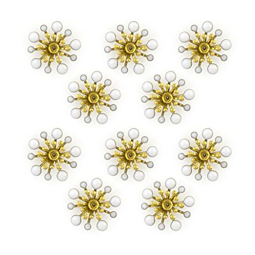 Close-up of white enamel and brass flower sew-on trim.
