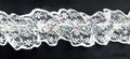 Nylon sequin lace elastic trim in white on a roll