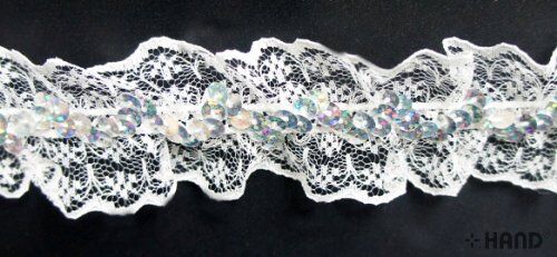 Nylon sequin lace elastic trim in white on a roll