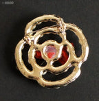 Close-up of a pearl brooch showcasing its intricate design.