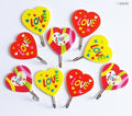 Three heart shape self adhesive hooks in a pack.