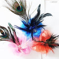 Three peacock feather flower headdresses displayed together.